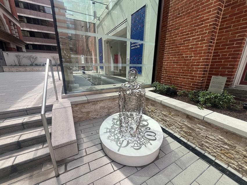 Planet Word greets you with installation arts like this figure (Silver Adagio by Jaume Plensa) made up of stainless steel symbols from nine different writing systems.
