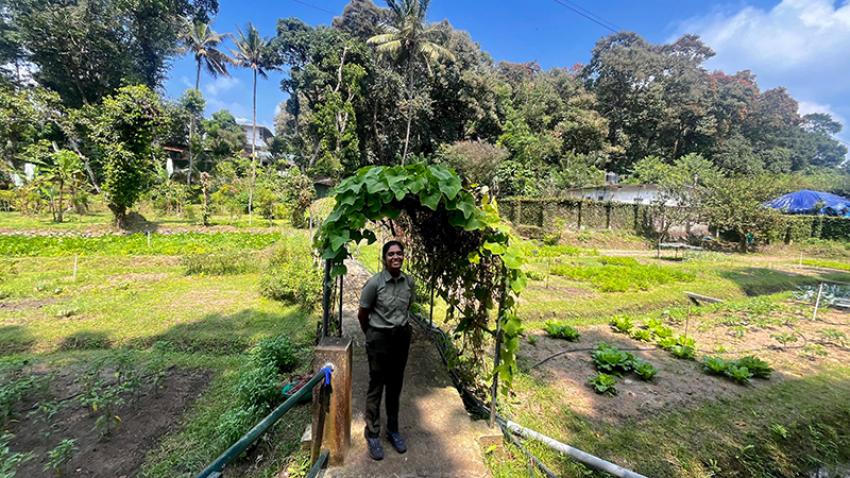 Alka, the naturalist at Spice village on a guided tour of the organic farm